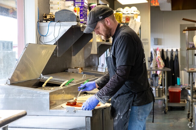 Have some hand made pizza at High Rise Pizza, it's just around the corner from Oak Hills.