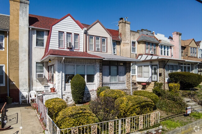 A row of two-story character homes lines this Logan neighborhood.