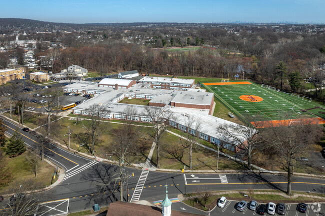 An elevated view of Florence M. Gaudineer Middle School in Springfield with NYC in the distance.