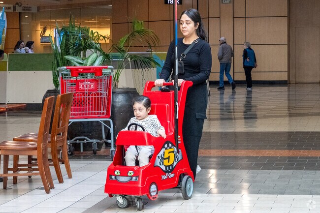 Families from Hidden Glen South enjoy a casual stroll inside Westfield Oakridge Mall.