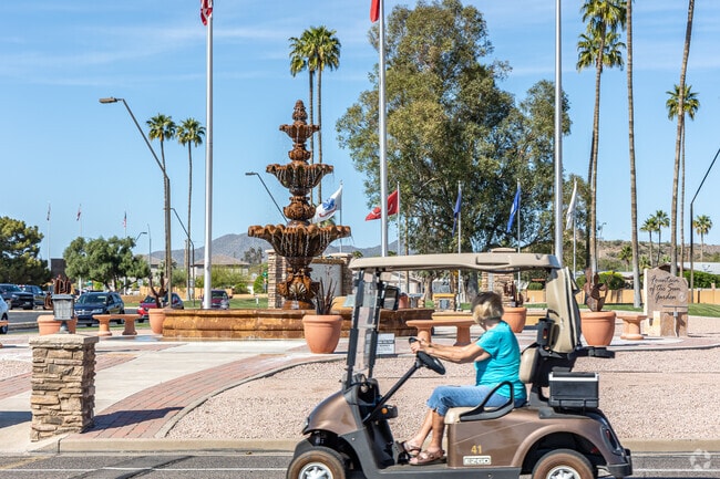 Residents of the community drive their golf carts to the Fountain of the Sun Country Club for a round of golf.
