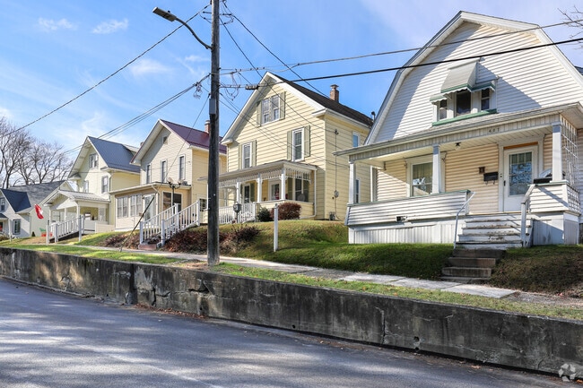 A row of homes featuring classic American architectural styles sits in the heart of Grove City.