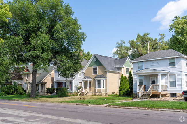 Homes with colorful facades and welcoming porches line the streets of Wellington Heights.