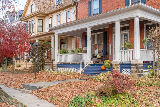 Cozy entrances to traditional American homes offer welcoming seasonal comfort.