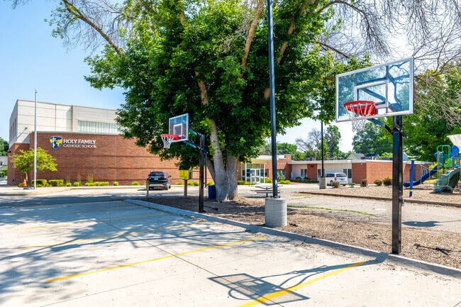 Basketball courts just outside the school allow for fun and physical education.