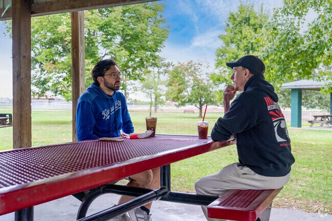 Neighbors gather at the pavilions in Ashland City Park.