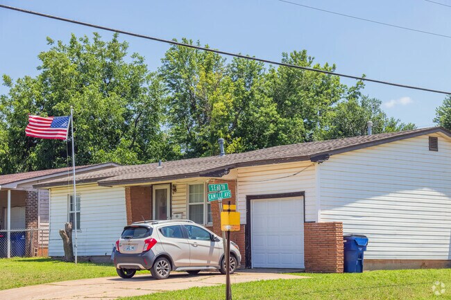 A traditional-style home flying an American flag stands in the heart of Valley Brook-Crossroads.