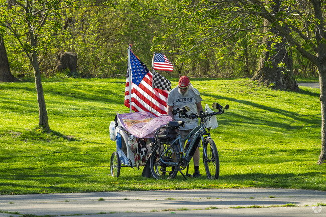 Downtown Flat Rock locals enjoy a ride with their dogs on a warm spring day.
