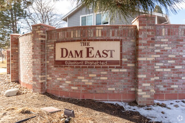 An entrance sign marks the Dam East Covenant Protected Community in Aurora, Colorado.