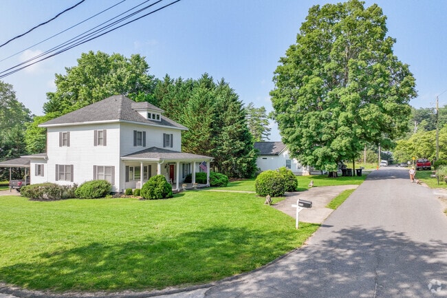 Some houses in Murphy are separated by trees.