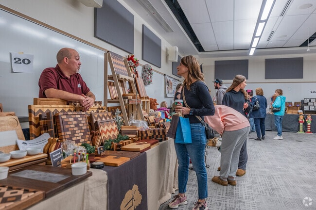 Lawrence residents get a lesson on woodwork products at the Peters Township Craft and Vendor Show.