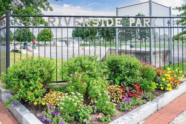 The Riverside park sign the neighborhood namesake welcomes you
