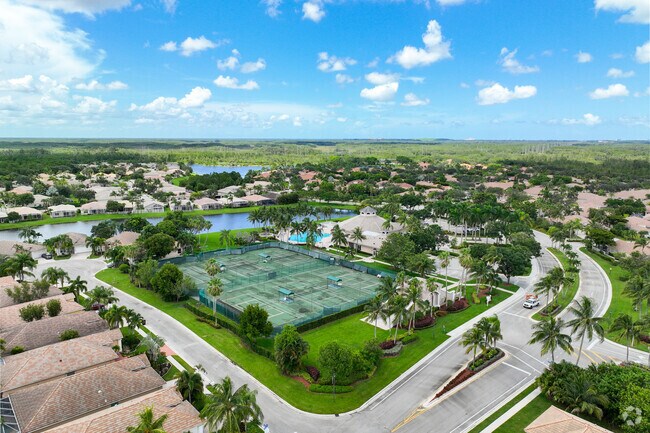 Aerial view of a tennis court facility at Andros Isle gated community.
