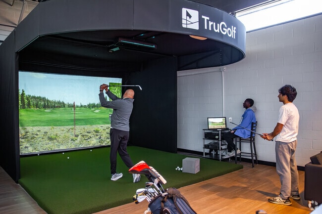 The YMCA’s new golf simulator attracts residents from Monocacy Village and beyond.