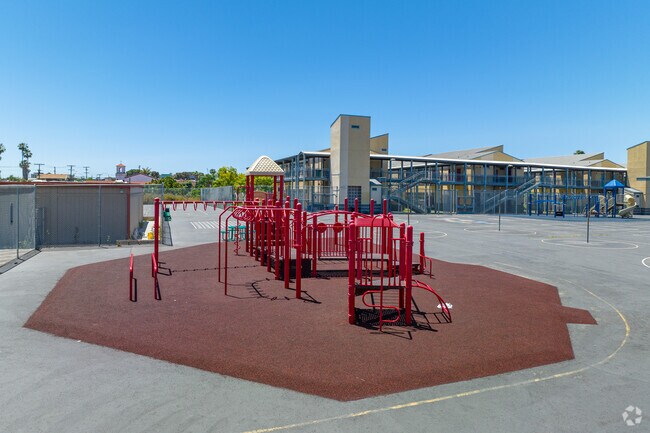 Ibarra Elementary School's playground features a distinctive red play-set.