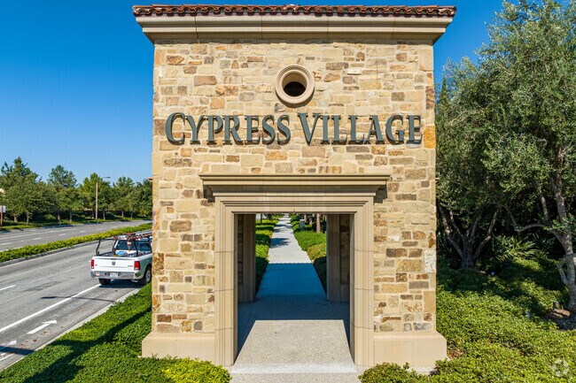 Cypress Village features an ornate sign at the entrance to the neighborhood.