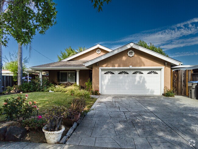 This Lovely Rancher Home Shaded From The Sun By Its Own Tree.
