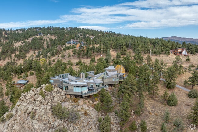 The larger lot sizes provide privacy, with some properties featuring secluded, wooded areas.