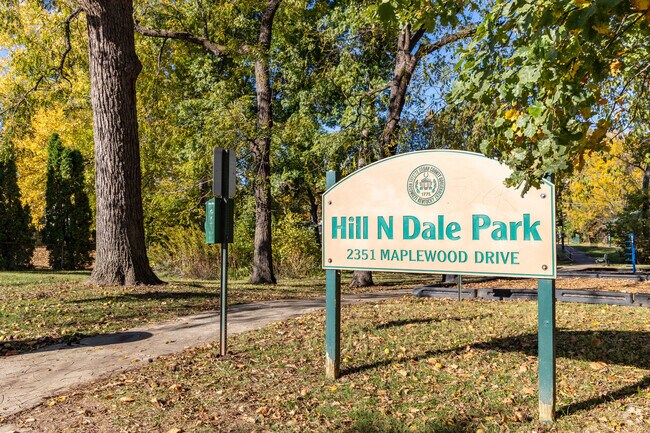 Hill N Dale Park includes a merry-go-round, slide, swings, paved trail and basketball court.