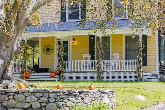 Harvest decorations with corn shocks adorn an antique home in the Pocasset Heights neighborhood.