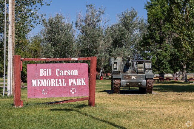 Bill Carson Memorial Park honors history with a tank display amidst lush greenery in Helena.