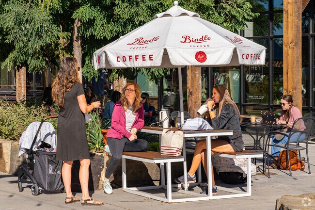 A group of Stonehenge friends enjoy their hot drinks on the Bindle Coffee patio.