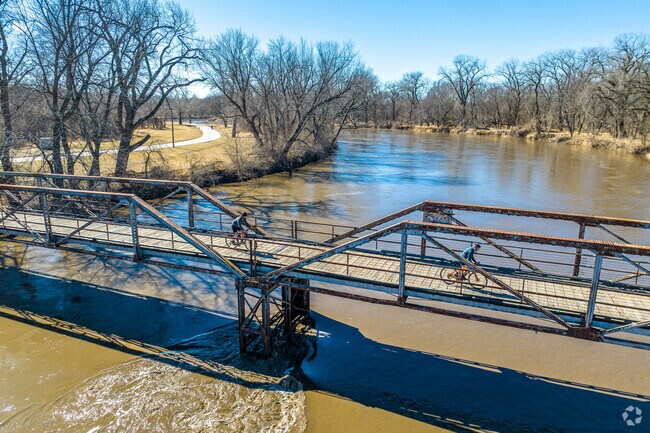 A trail bridge over Raccoon River gives Haines Park residents plenty of space to walk or jog.