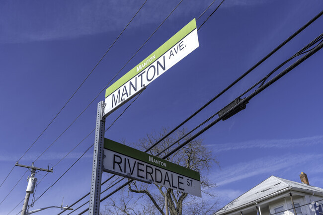 Navigate through Manton Ave. and Riverdale St. streets, where signs guide you in Manton.