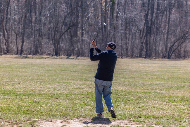Locals practice their irons at the John Capelli Memorial Driving Range in Wayne.