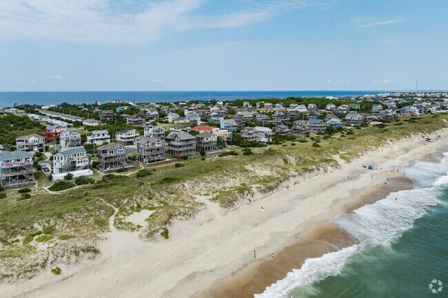 Discover coastal living with unique home styles and striking architectural detail in Waves, NC.