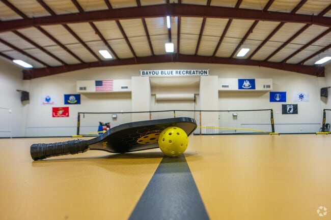 The gym onsite at Bayou Blue Recreation has multiple pickle ball courts set up for daily play every week.