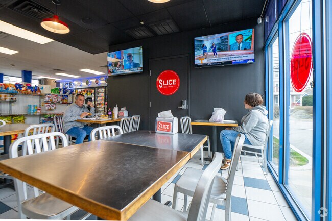 If you've got time, pull up a chair and enjoy your food inside Slice Pizza in Montrose.