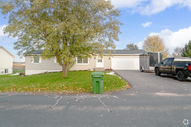 Traditional style homes in Star Prairie feature attached garages.