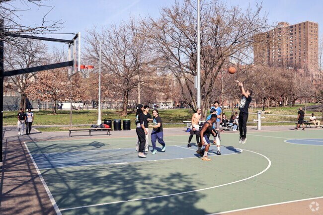 Locals of the Melrose community enjoying a game of basketball at St Mary's Park.