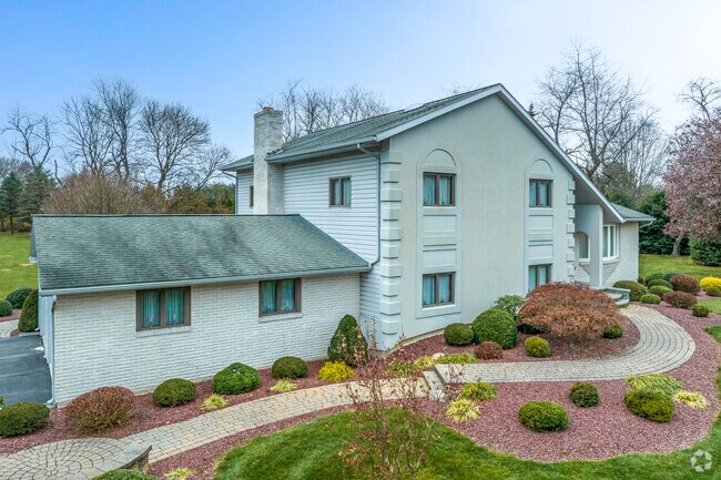 A comfortable split-level home contributes to the neighborhood charm in Bushkill Township.