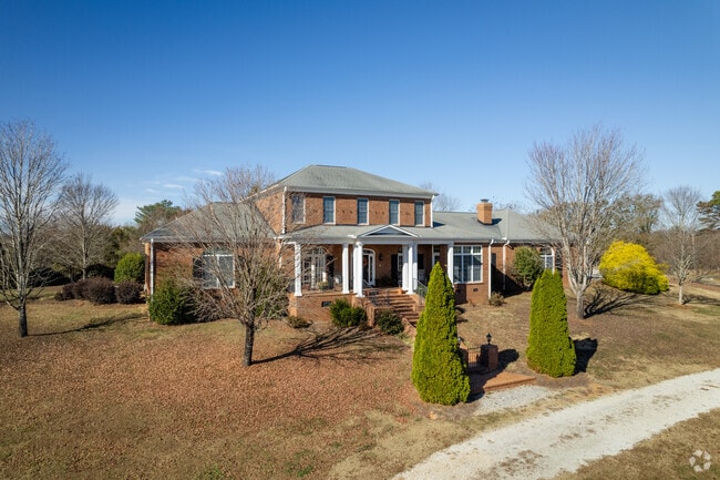 A few large brick classical style homes can be found in Dacusville.