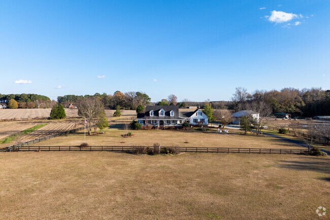 Rolling hills and farmland surround the town of Pine Level, NC.
