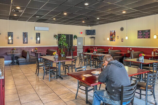 A local dines at Sophia's restaurant in Saint Lawrence.