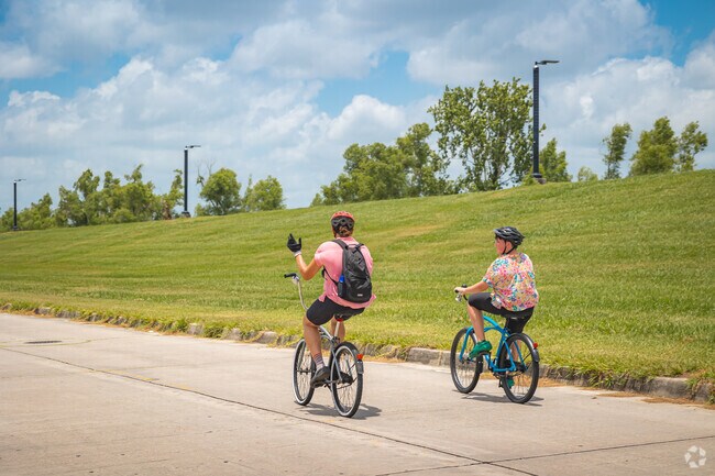 Whitney residents enjoy riding along the riverwalk.