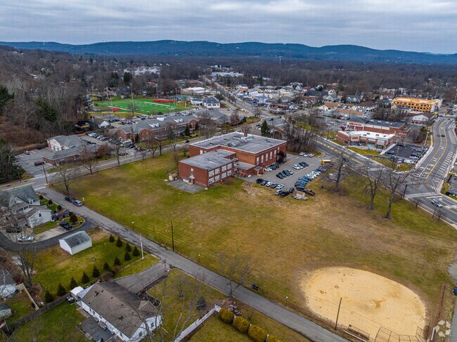 Chapel Hill Academy has a large green area around the school for recreation.