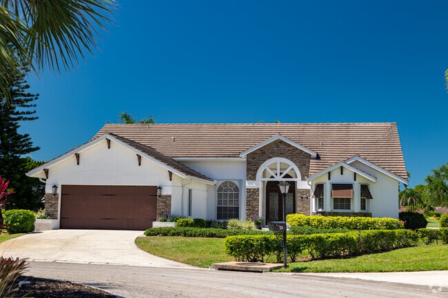 Lely Country Club features a number of single-story ranch homes with updated styling.