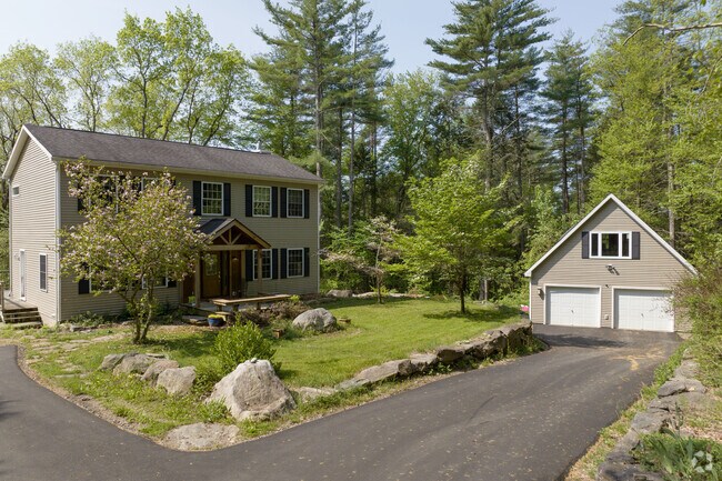 Large lots feature modern Colonial homes in East Riverton.