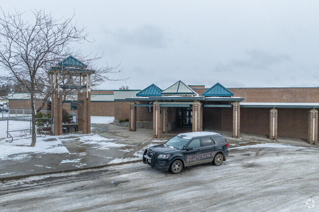 Salnave Elementary features a large brick building for its students.