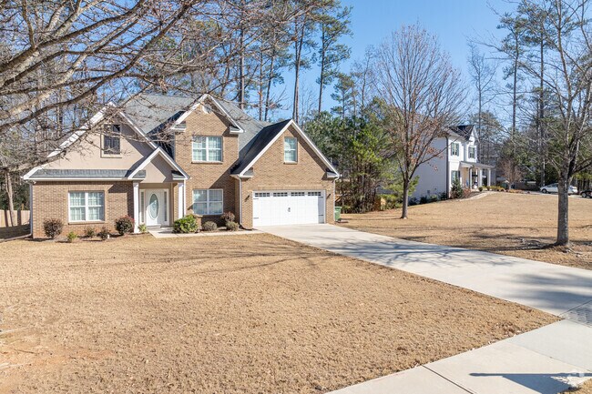 Traditional brick homes set back on large lots are common in the Chalet Woods area.