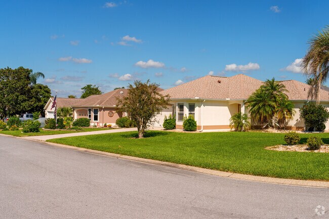 This row of homes showcases lush landscaping in the Village of Palo Alto.