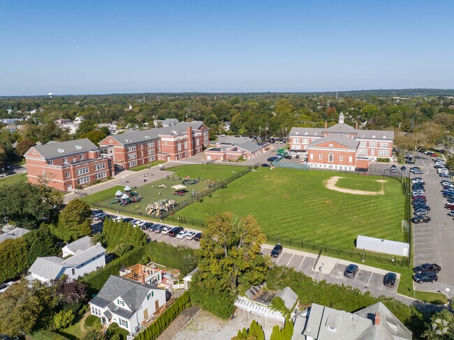 There is a large baseball field and playground right behind the school.