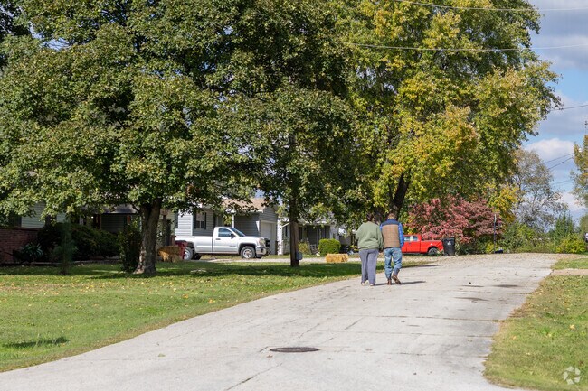 Tree-lined roads in West Springfield provide a peaceful setting for neighborhood strolls.