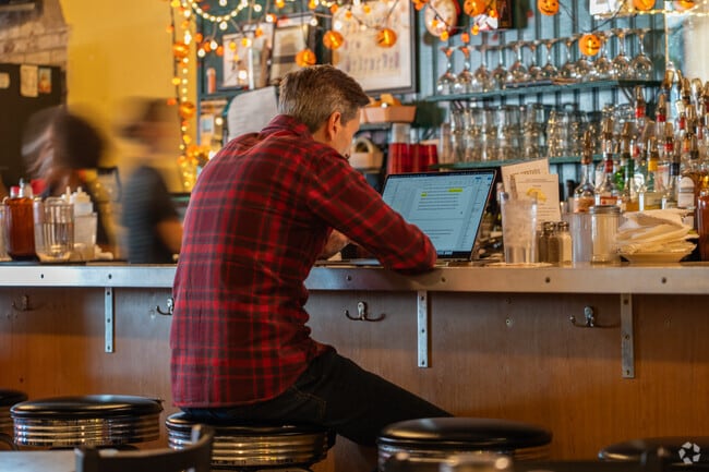 A local resident spends his time writing in one of Ginter Parks many diners.