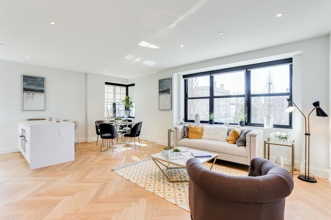 Open living and dining concept with lots of natural light, hardwood floors and Nest temperature control system.