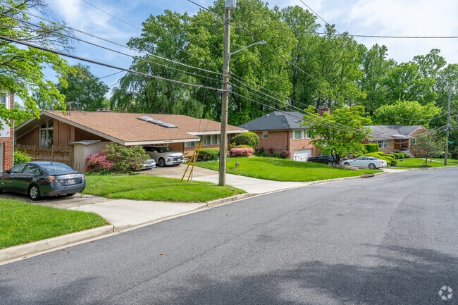 A ranch next to a couple of ramblers on Portal Dr NW in Colonial Village.